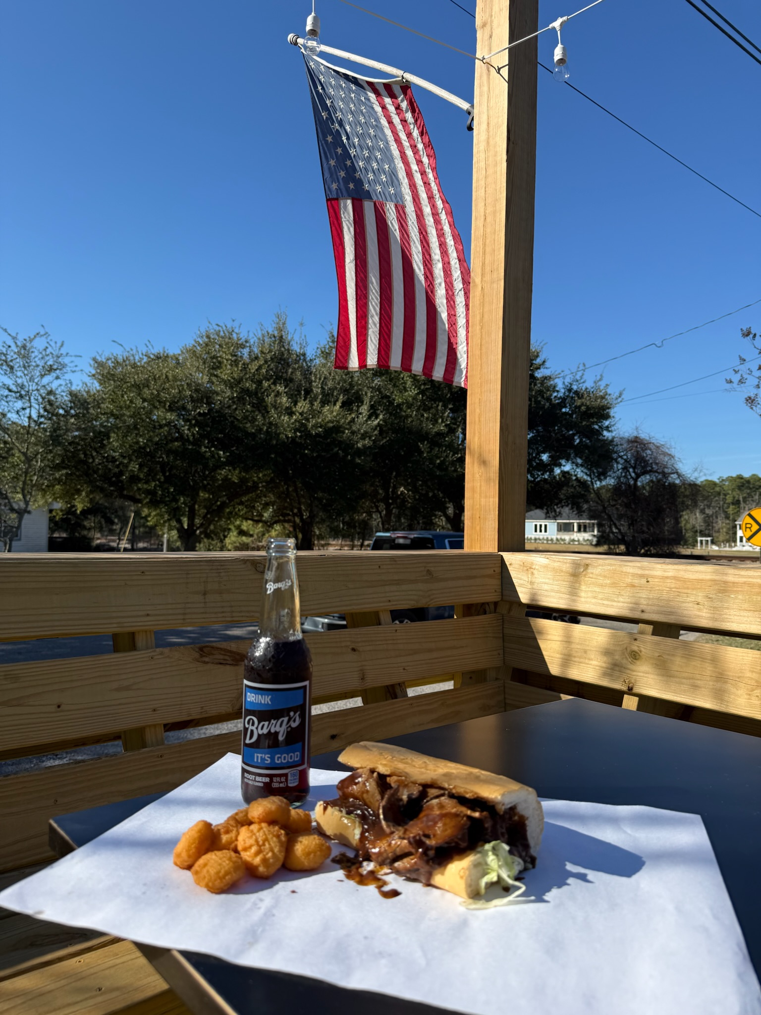 Roast beef po-boy with secret gravy and corn nuggets on the deck